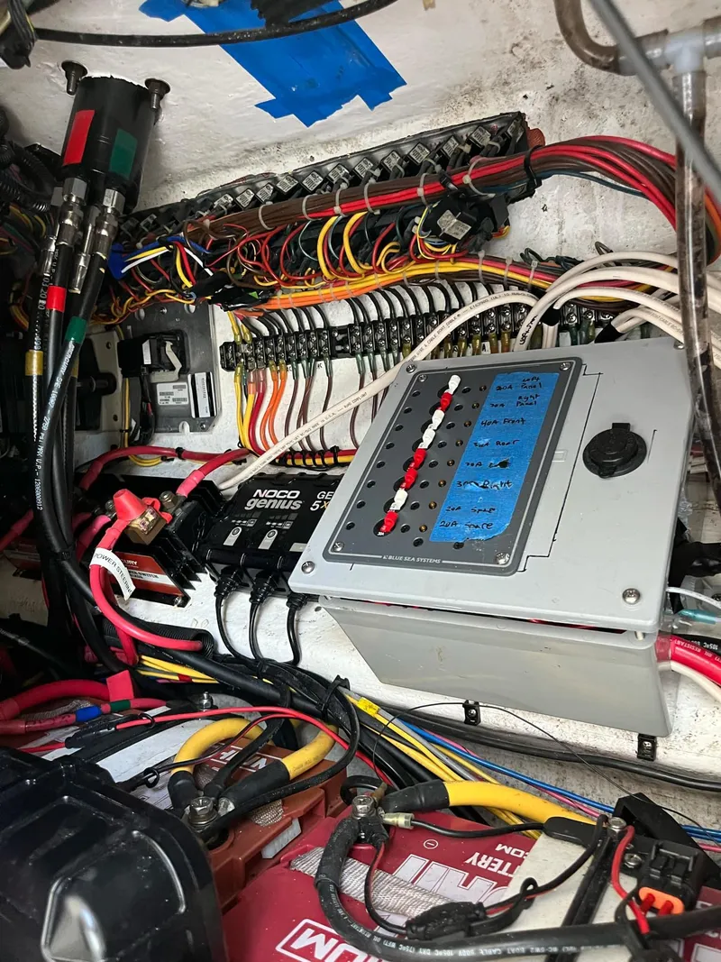 Slide: The Image of Electrical wiring and control panel inside a 2021 Invincible 39 Open Fisherman boat. - 13