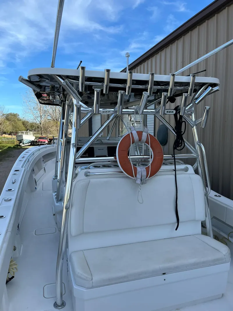 Slide: The Image of 2021 Invincible 39 Open Fisherman boat with rod holders and life preserver. - 14