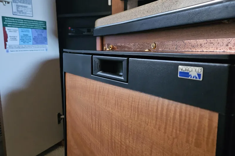 Slide: The Image of Norcold refrigerator in 2006 Sea Ray 270 Amberjack boat interior. - 15