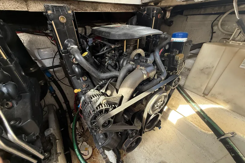 Slide: The Image of Engine compartment of a 2006 Sea Ray 270 Amberjack boat, showcasing mechanical components. - 20