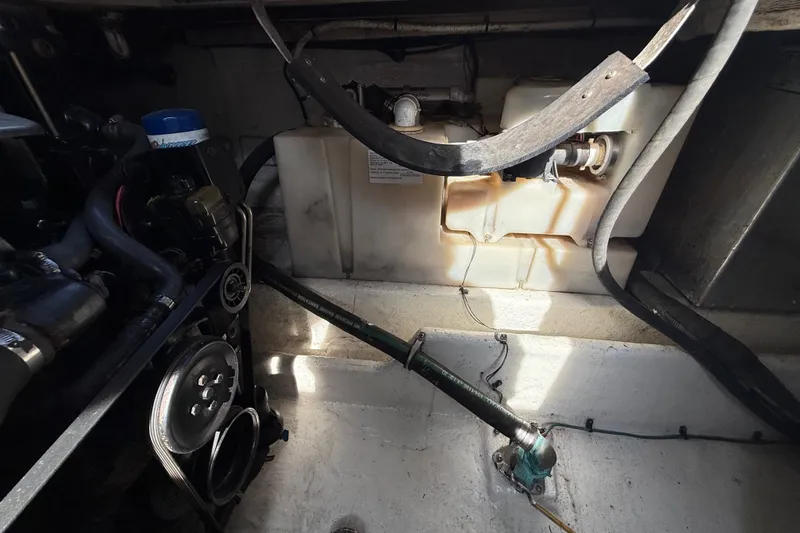Slide: The Image of Engine compartment of a 2006 Sea Ray 270 Amberjack boat, showing mechanical components. - 21