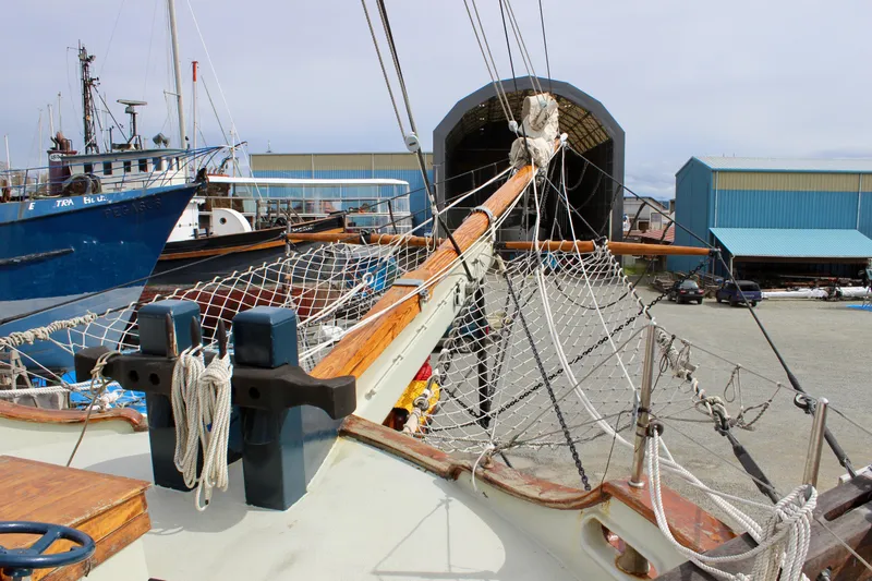 Slide: The Image of Square topsail ketch in shipyard, Lahaina Welding Co., 1988, with rigging and maritime equipment. - 10