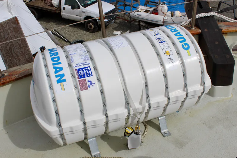 Slide: The Image of Life raft on 1988 Lahaina Welding Co. Square Topsail Ketch deck, labeled "Guardian." - 21