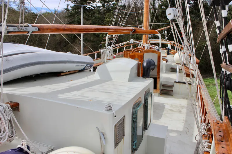 Slide: The Image of 1988 Custom Lahaina Welding Co. Square Topsail Ketch deck with rigging and dinghy. - 23