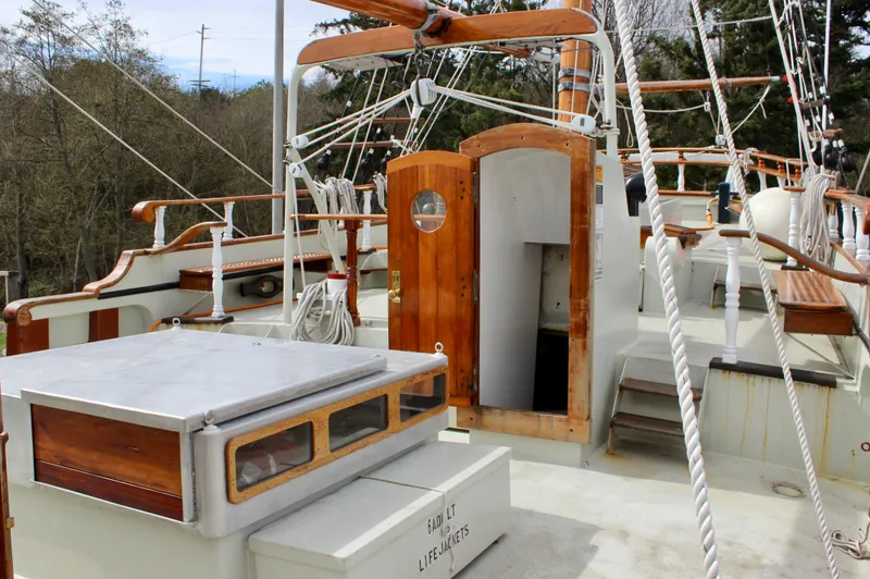 Slide: The Image of 1988 Custom Lahaina Welding Co. Square Topsail Ketch with wooden deck and rigging details. - 25