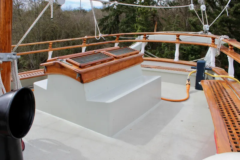 Slide: The Image of Deck of 1988 Custom Lahaina Welding Co. Square Topsail Ketch with wooden details and rigging. - 29
