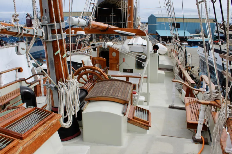 Slide: The Image of 1988 Custom Lahaina Welding Co. Square Topsail Ketch with wooden deck and rigging details. - 30