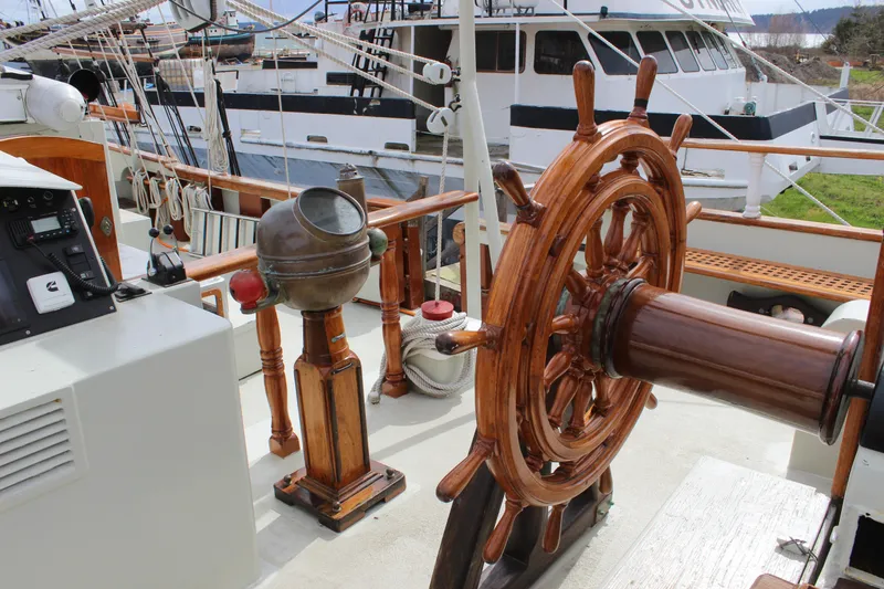 Slide: The Image of Wooden helm and binnacle on 1988 Lahaina Welding Co. Square Topsail Ketch deck. - 37