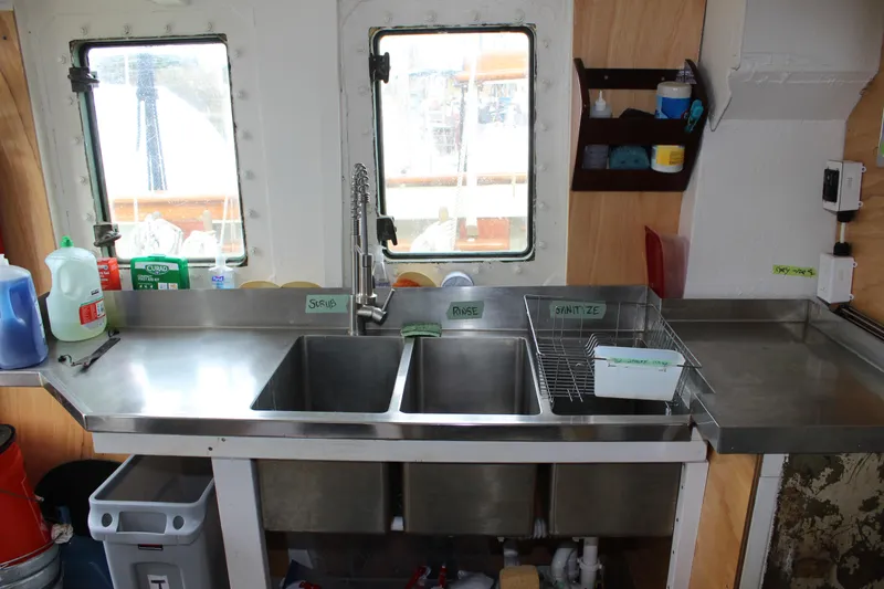 Slide: The Image of Stainless steel kitchen sink on 1988 Lahaina Welding Co. Square Topsail Ketch boat. - 42