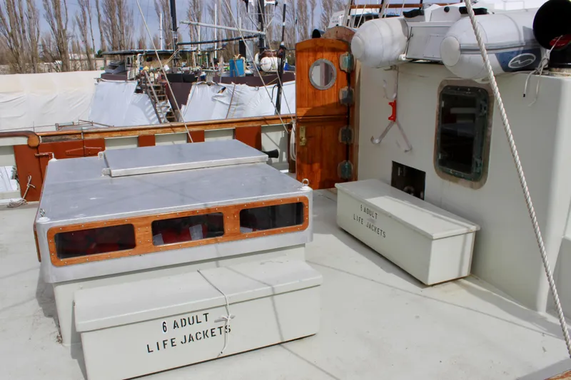 Slide: The Image of 1988 Custom Lahaina Welding Co. Square Topsail Ketch deck with life jacket storage. - 5