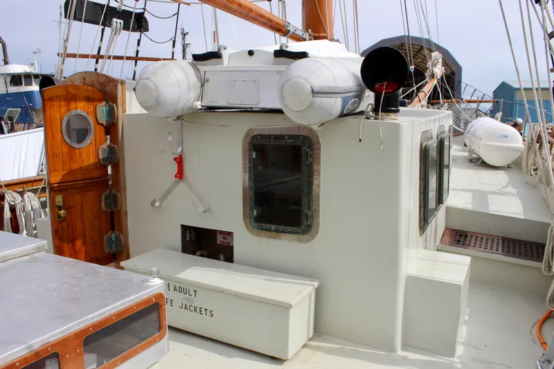 Slide: The Image of 1988 Custom Lahaina Welding Co. Square Topsail Ketch deck with life rafts and wooden door. - 9