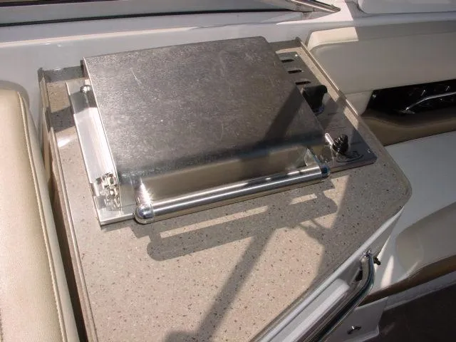 Slide: The Image of Built-in grill on 2011 Regal 2750 Cuddy boat, featuring stainless steel design. - 12
