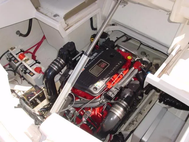 Slide: The Image of Engine compartment of a 2011 Regal 2750 Cuddy boat, showcasing detailed mechanical components. - 13