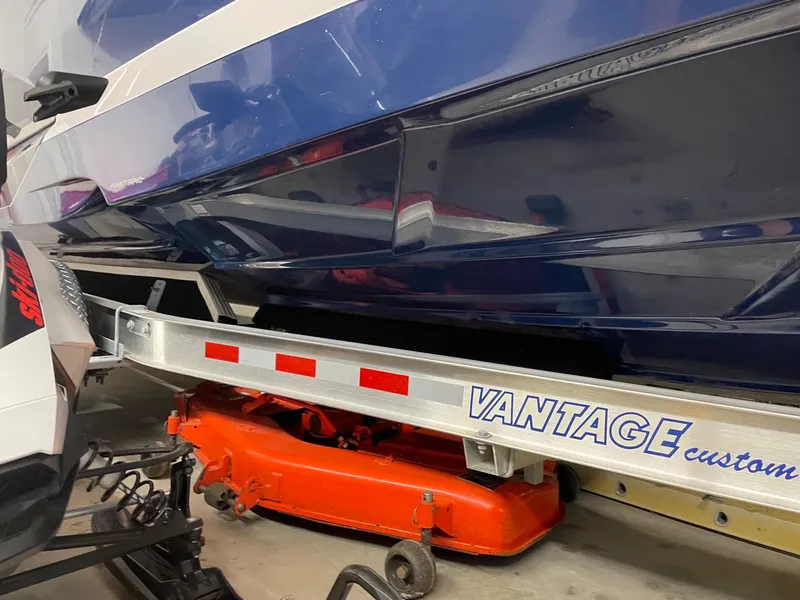 Slide: The Image of 2011 Regal 2750 Cuddy boat on Vantage custom trailer in garage. - 19