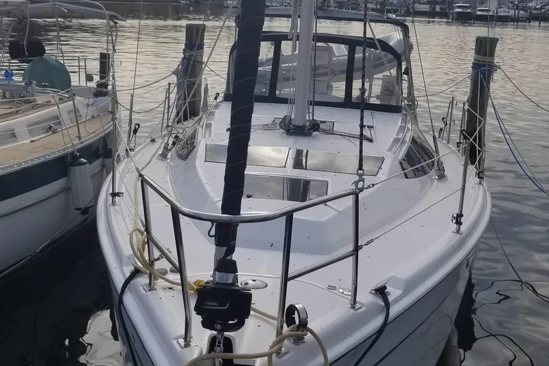 Slide: The Image of 2011 Hunter e36 sailboat docked in marina, front view. - 14