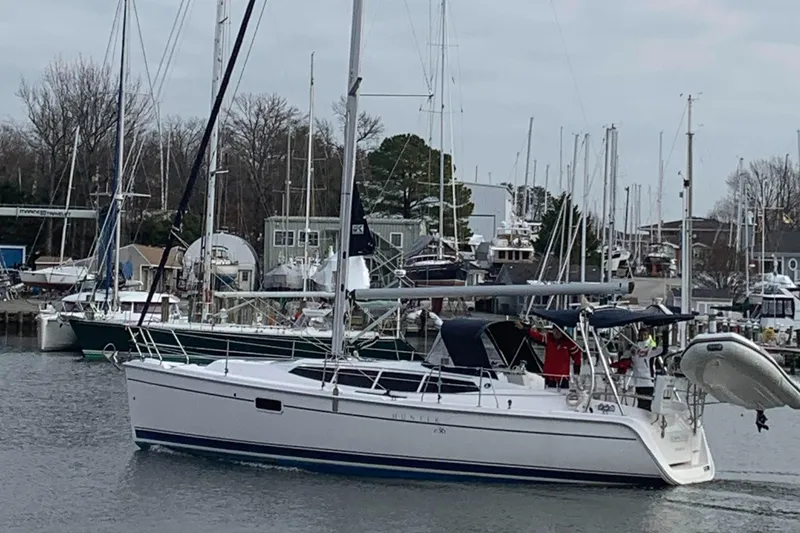 Slide: The Image of Sailboat Hunter e36 2011 docked in a marina with other boats. - 2