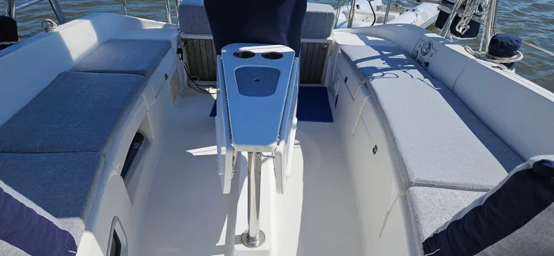 Slide: The Image of Spacious cockpit of 2011 Hunter e36 sailboat with cushioned seating and table. - 26