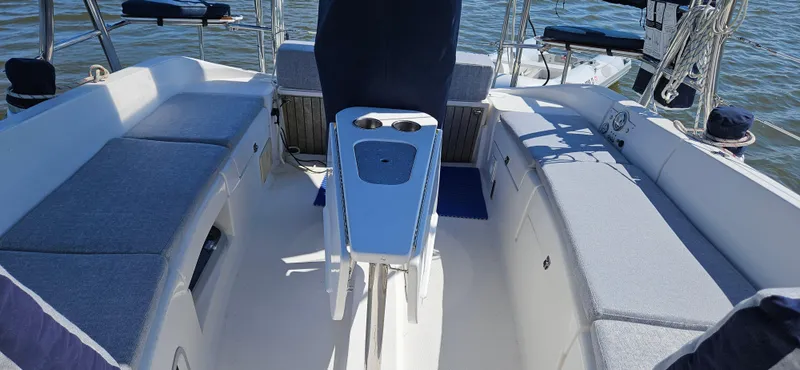 Slide: The Image of Spacious cockpit of 2011 Hunter e36 sailboat with cushioned seating and central console. - 27