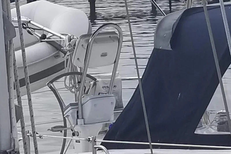 Slide: The Image of Sailboat Hunter e36, 2011 model, docked with visible ladder and canopy. - 30