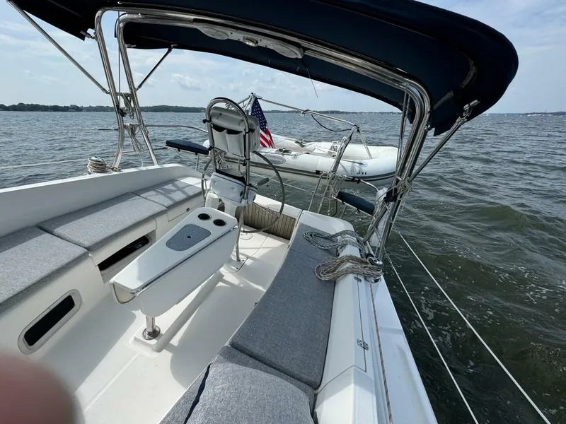 Slide: The Image of Sailboat Hunter e36 2011 on water, featuring spacious deck and seating area. - 33