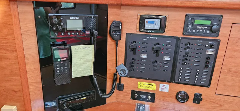 Slide: The Image of Control panel of a 2011 Hunter e36 sailboat with navigation and communication equipment. - 46