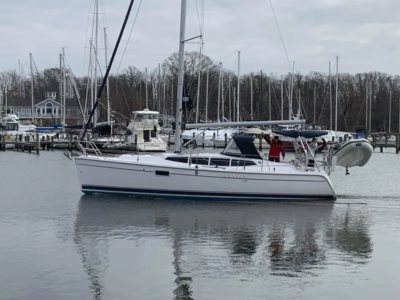 Slide: The Image of Sailboat Hunter e36 2011 docked in a marina with calm waters and overcast sky. - 5