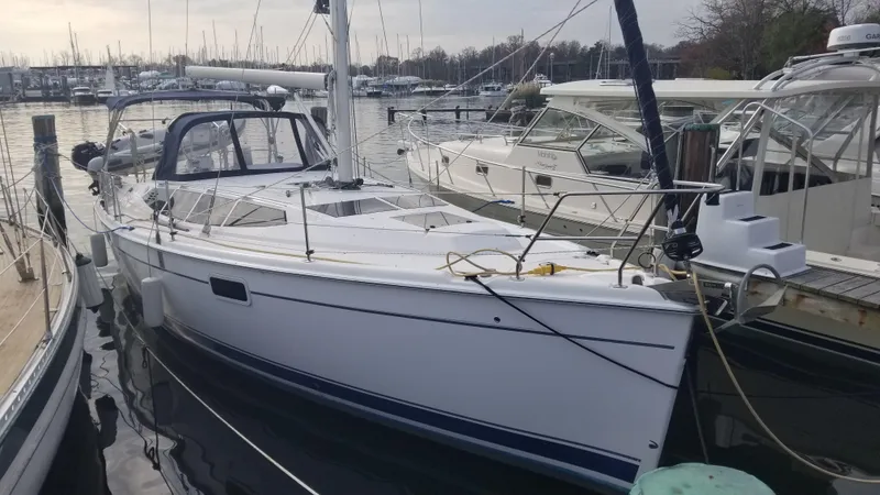 Slide: The Image of Hunter e36 2011 sailboat docked at marina, surrounded by other boats. - 7