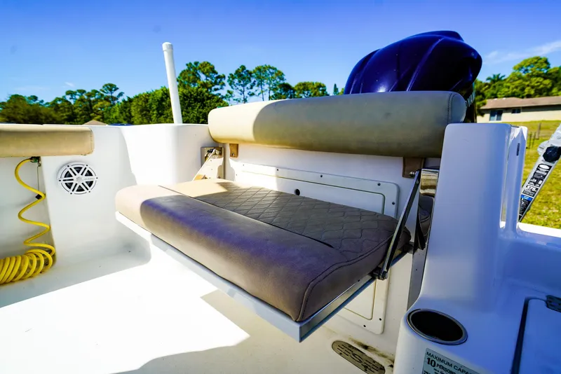 Slide: The Image of 2019 Sportsman 232 Open Platinum boat with cushioned seating and outdoor speaker. - 14