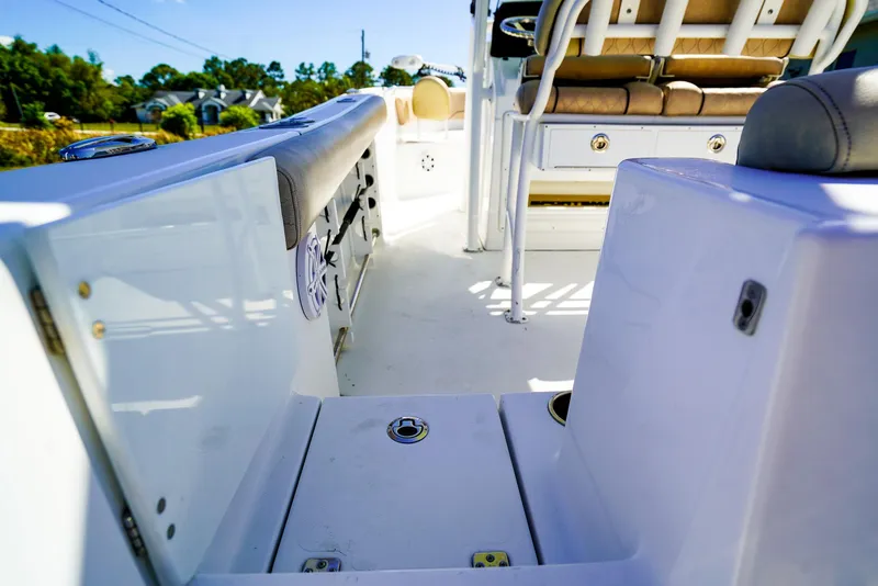 Slide: The Image of 2019 Sportsman 232 Open Platinum boat interior with seating and storage compartments. - 15