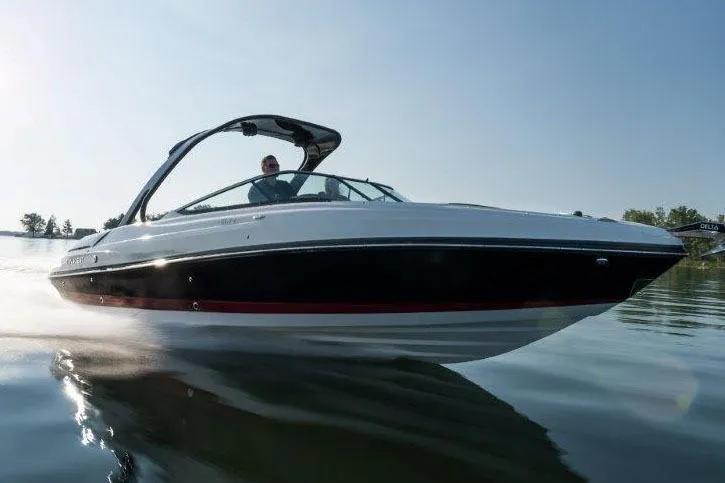 Slide: The Image of 2017 Rinker QX29 BR boat cruising on a calm lake. - 25
