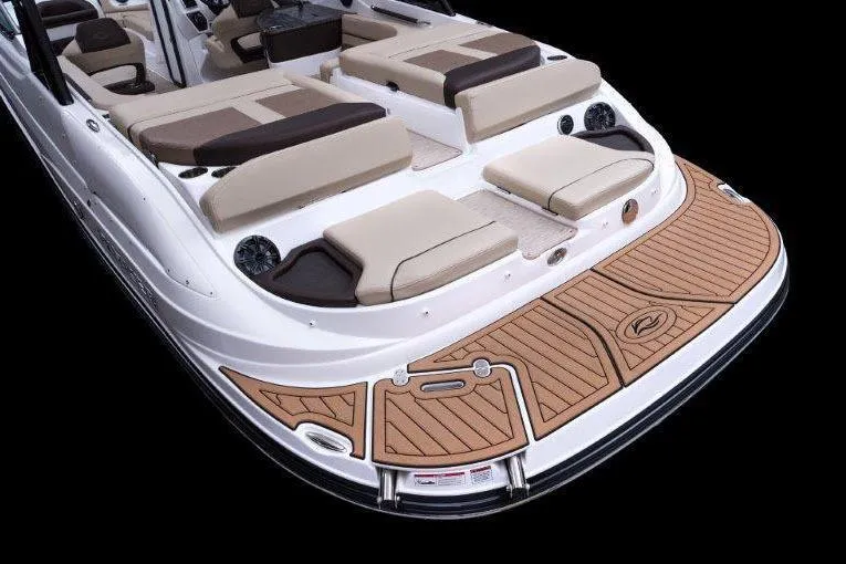 Slide: The Image of 2017 Rinker QX29 BR boat with spacious seating and elegant deck design. - 28