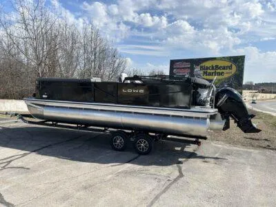 Slide: The Image of 2025 Lowe LS 230 pontoon boat on trailer at BlackBeard Marine dealership. - 3