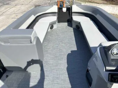 Slide: The Image of 2025 Lowe LS 230 boat interior with spacious seating and modern design. - 7