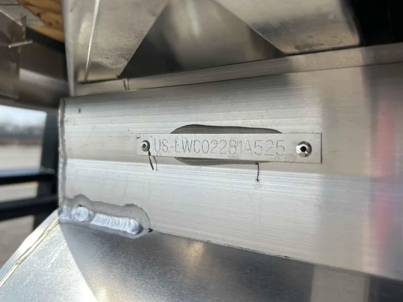 Slide: The Image of VIN plate on 2025 Lowe LS 230 boat, showcasing identification details. - 9