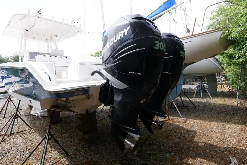 Slide: The Image of 2008 Marlago FS 35 Center Console Cuddy with twin Mercury outboard engines on stands. - 17