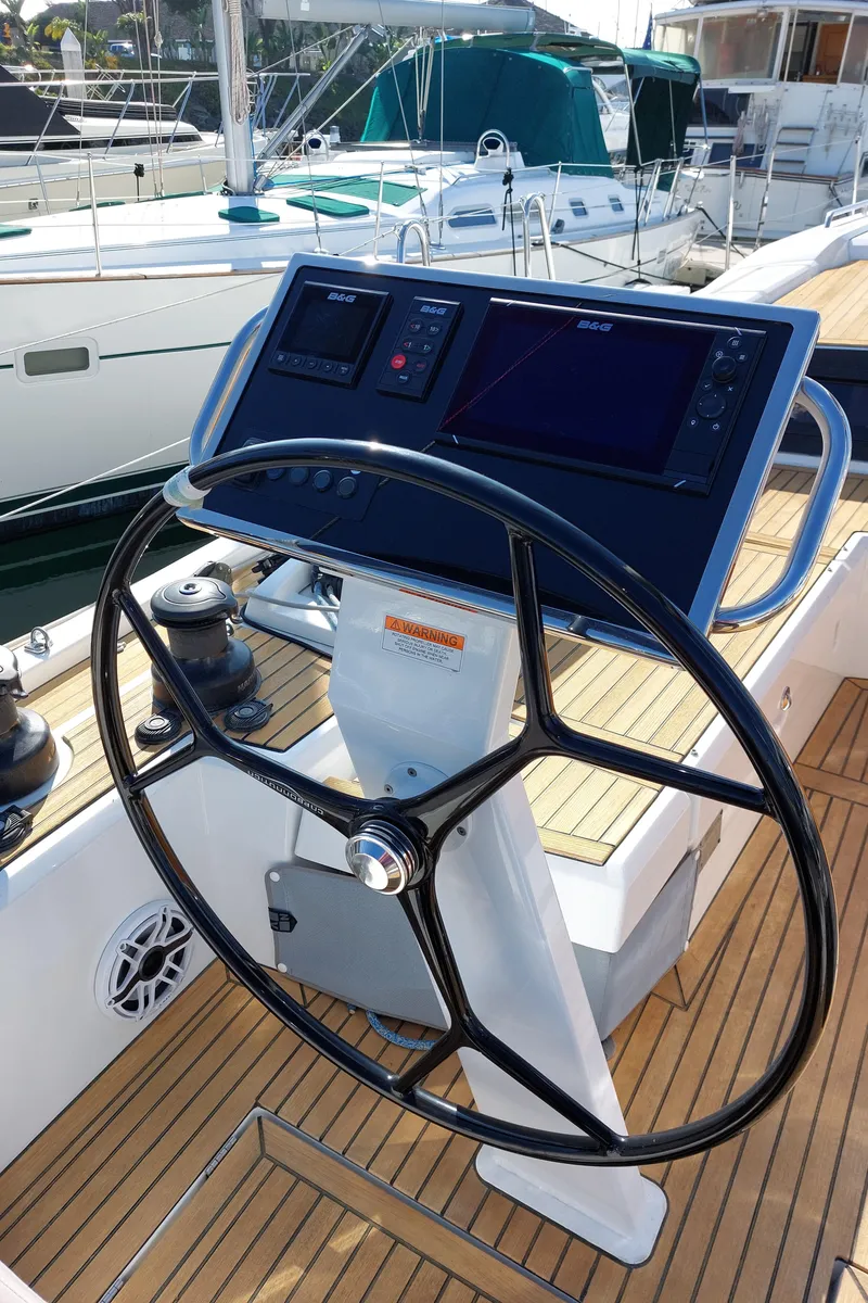 Slide: The Image of Steering wheel and navigation panel of 2022 Beneteau Oceanis 46.1 yacht. - 12