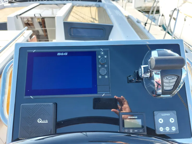 Slide: The Image of Control panel of 2022 Beneteau Oceanis 46.1 yacht with navigation and throttle systems. - 16