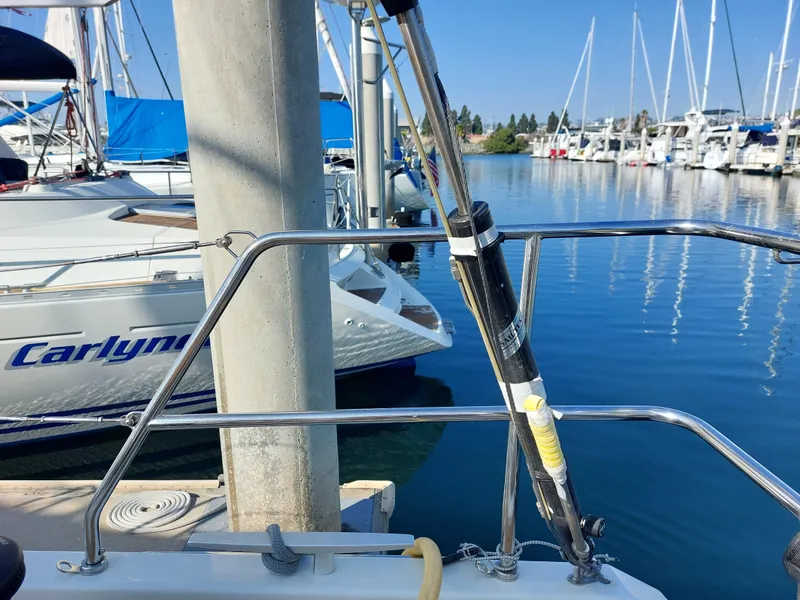 Slide: The Image of Beneteau Oceanis 46.1 sailboat docked in marina, 2022 model, with clear blue water. - 19
