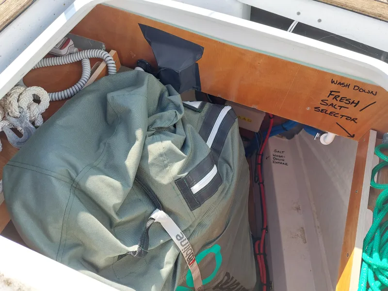 Slide: The Image of Storage compartment on a 2022 Beneteau Oceanis 46.1 sailboat with gear and washdown selector. - 22