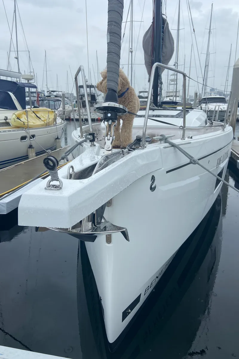 Slide: The Image of 2022 Beneteau Oceanis 46.1 yacht docked, featuring a dog on the bow. - 3