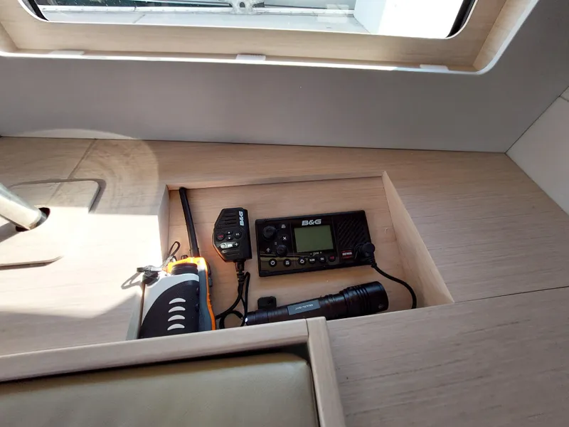 Slide: The Image of Beneteau Oceanis 46.1 2022 yacht interior with communication equipment and flashlight. - 32