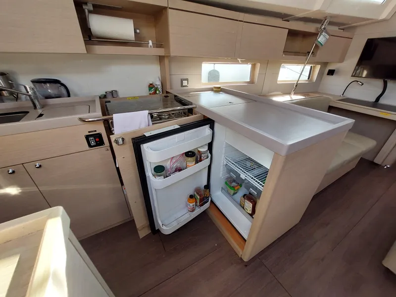 Slide: The Image of Modern kitchen interior of 2022 Beneteau Oceanis 46.1 yacht with open fridge. - 34