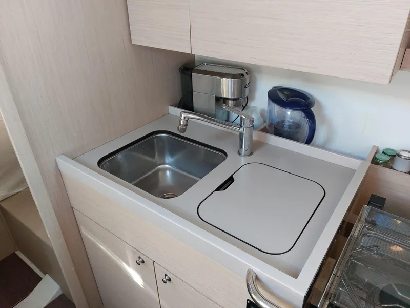 Slide: The Image of Modern kitchen sink area in 2022 Beneteau Oceanis 46.1 yacht. - 37