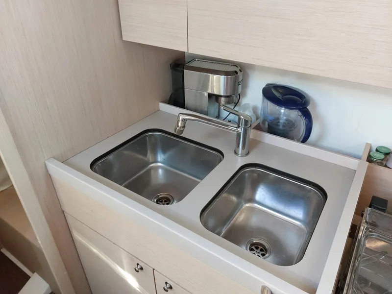 Slide: The Image of Modern kitchen sink in 2022 Beneteau Oceanis 46.1 yacht galley. - 38