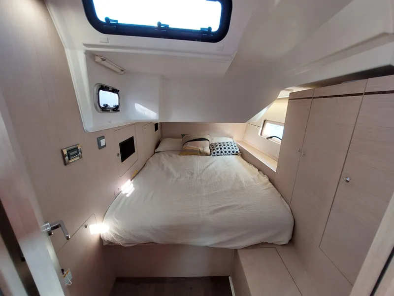 Slide: The Image of Interior cabin of 2022 Beneteau Oceanis 46.1 yacht with cozy bed and storage. - 39