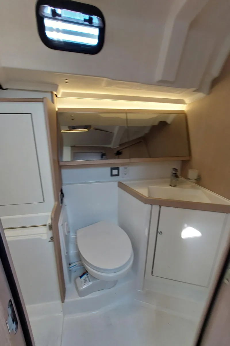 Slide: The Image of Beneteau Oceanis 46.1 2022 yacht bathroom with modern fixtures and compact design. - 41