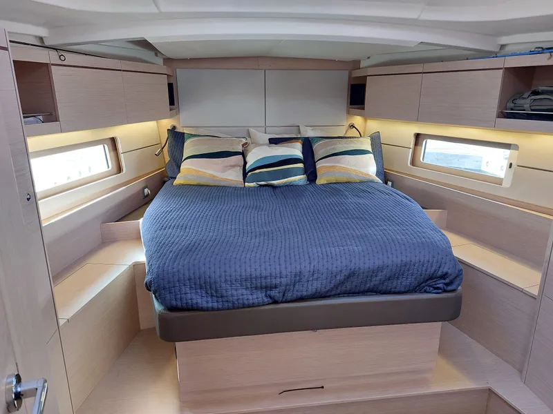 Slide: The Image of Luxurious cabin interior of 2022 Beneteau Oceanis 46.1 yacht with cozy bedding. - 42