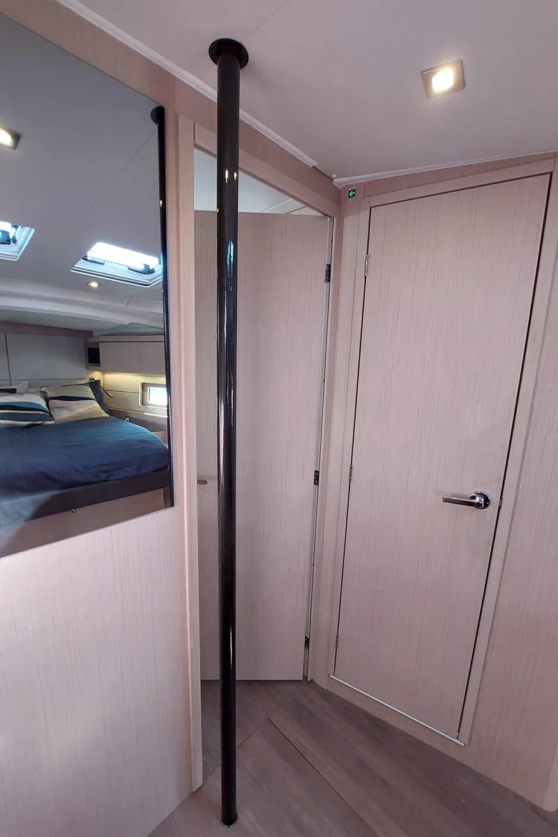 Slide: The Image of Interior of 2022 Beneteau Oceanis 46.1 yacht, featuring modern wood finish and sleek design. - 44