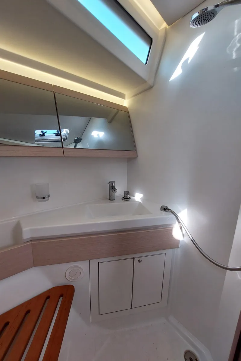 Slide: The Image of Beneteau Oceanis 46.1 2022 yacht bathroom with modern fixtures and skylight. - 45