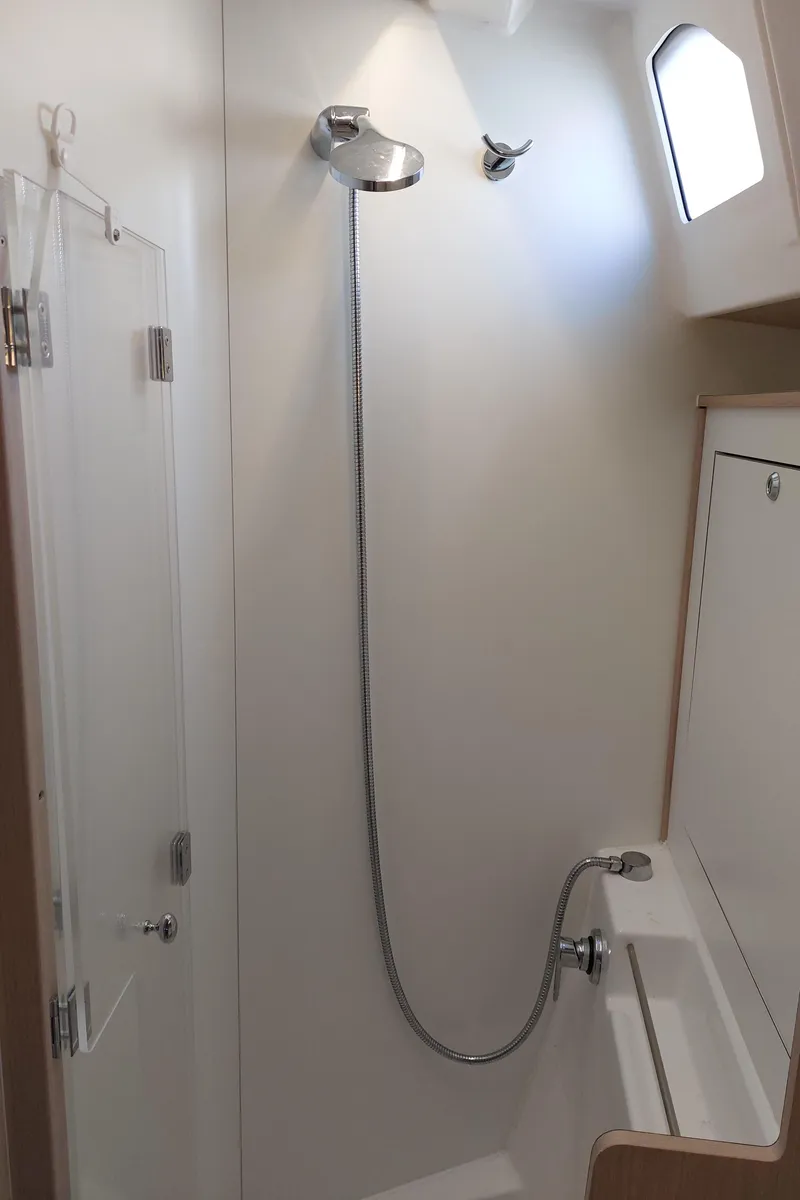 Slide: The Image of Beneteau Oceanis 46.1 2022 yacht bathroom with shower and window. - 46